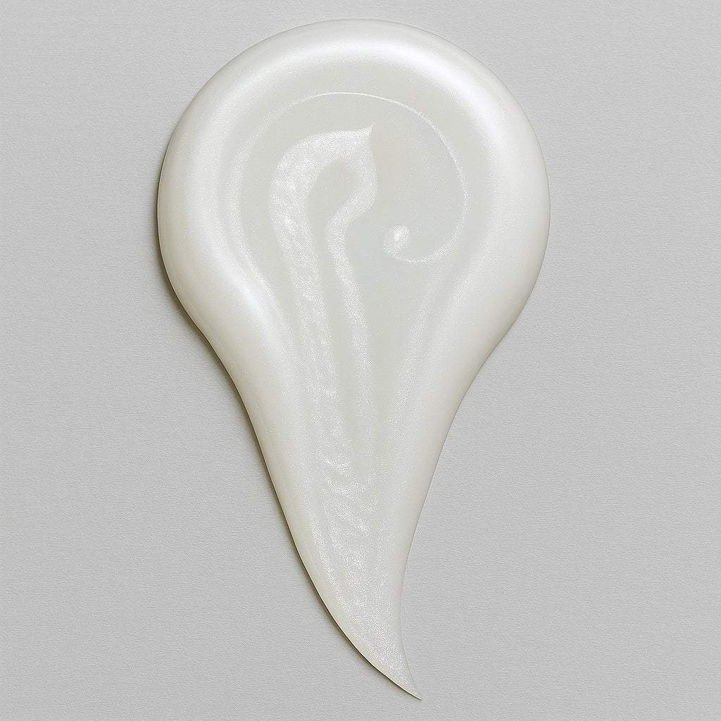 Creamy white texture swatch of CoilyGurls hair product showing consistency and application