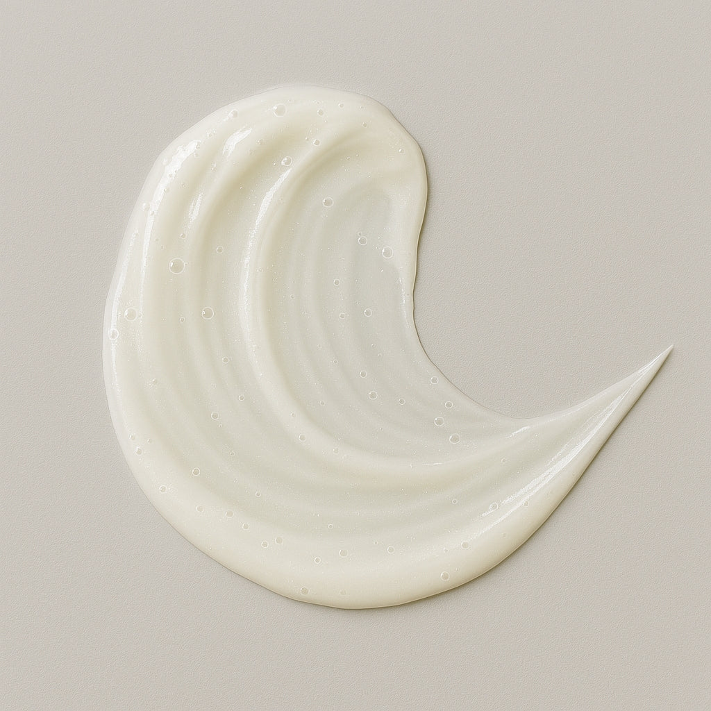 Creamy white texture swatch of Coily Gurls hair product showing consistency and application