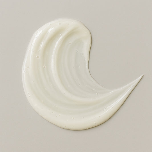 Creamy white texture swatch of Coily Gurls hair product showing consistency and application