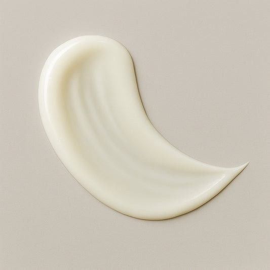 Creamy white texture swatch of CoilyGurls hair product showing consistency and application