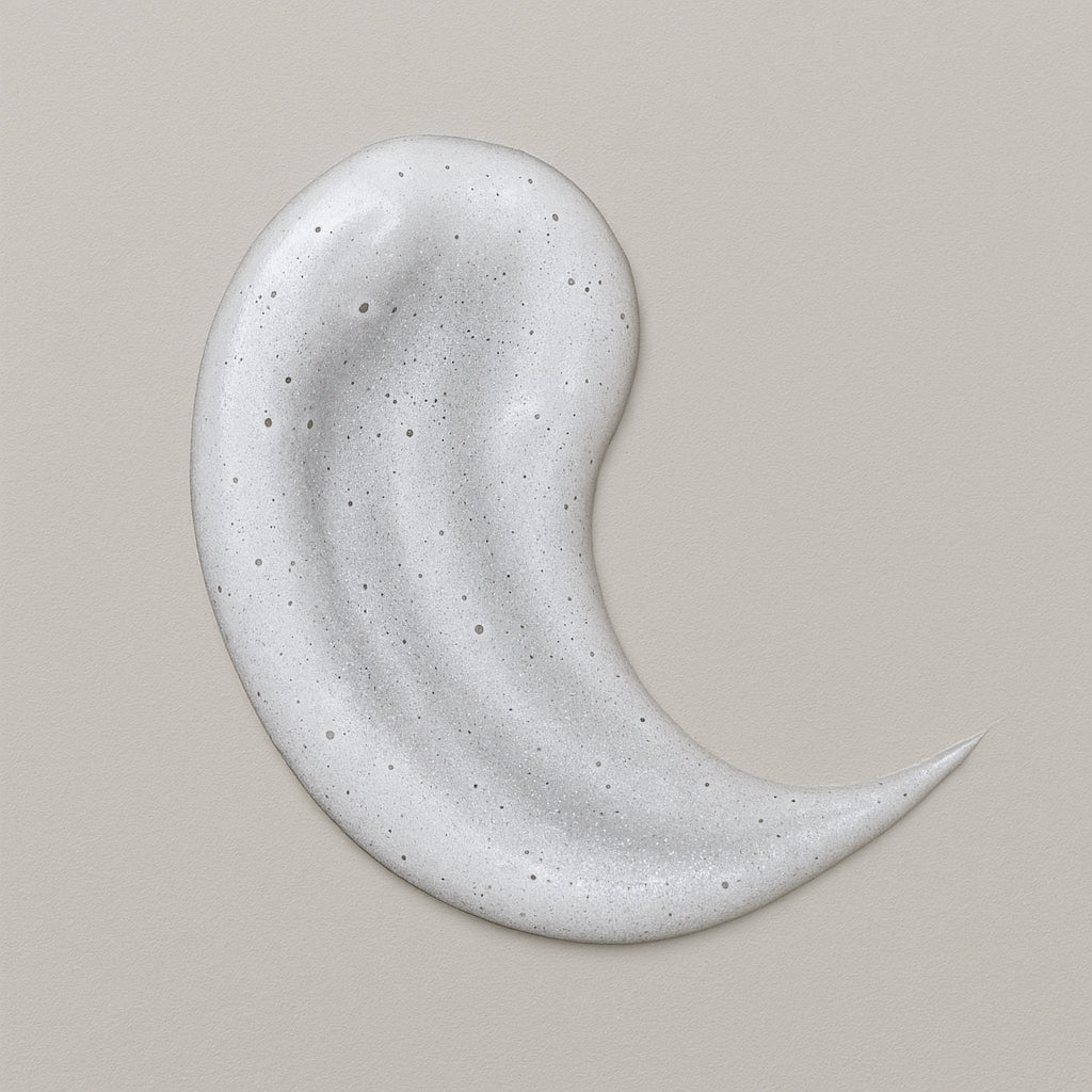 Creamy white texture swatch of CoilyGurls hair product showing consistency and application