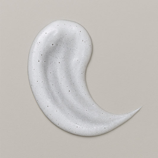 Creamy white texture swatch of CoilyGurls hair product showing consistency and application