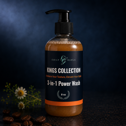 A pump bottle of Coily & Gurls Kings Collection 3-in-1 Power Wash, filled with brown hair product, set on a dark textured surface with coffee beans and small white flowers against a dark blue background.