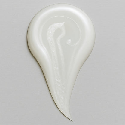 Creamy white texture swatch of CoilyGurls hair product showing consistency and application