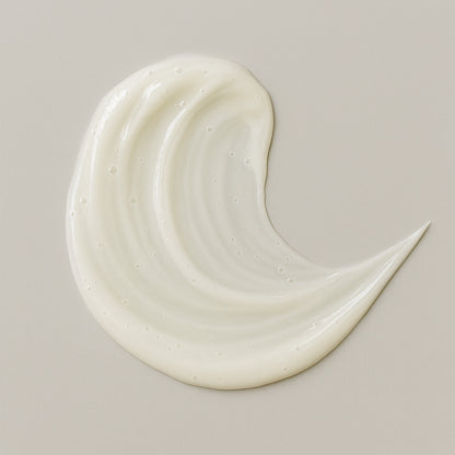 Creamy white texture swatch of Coily Gurls hair product showing consistency and application