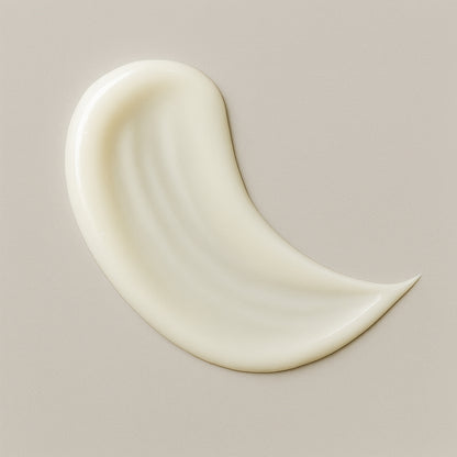 Creamy white texture swatch of CoilyGurls hair product showing consistency and application