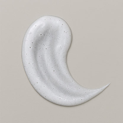 Creamy white texture swatch of CoilyGurls hair product showing consistency and application